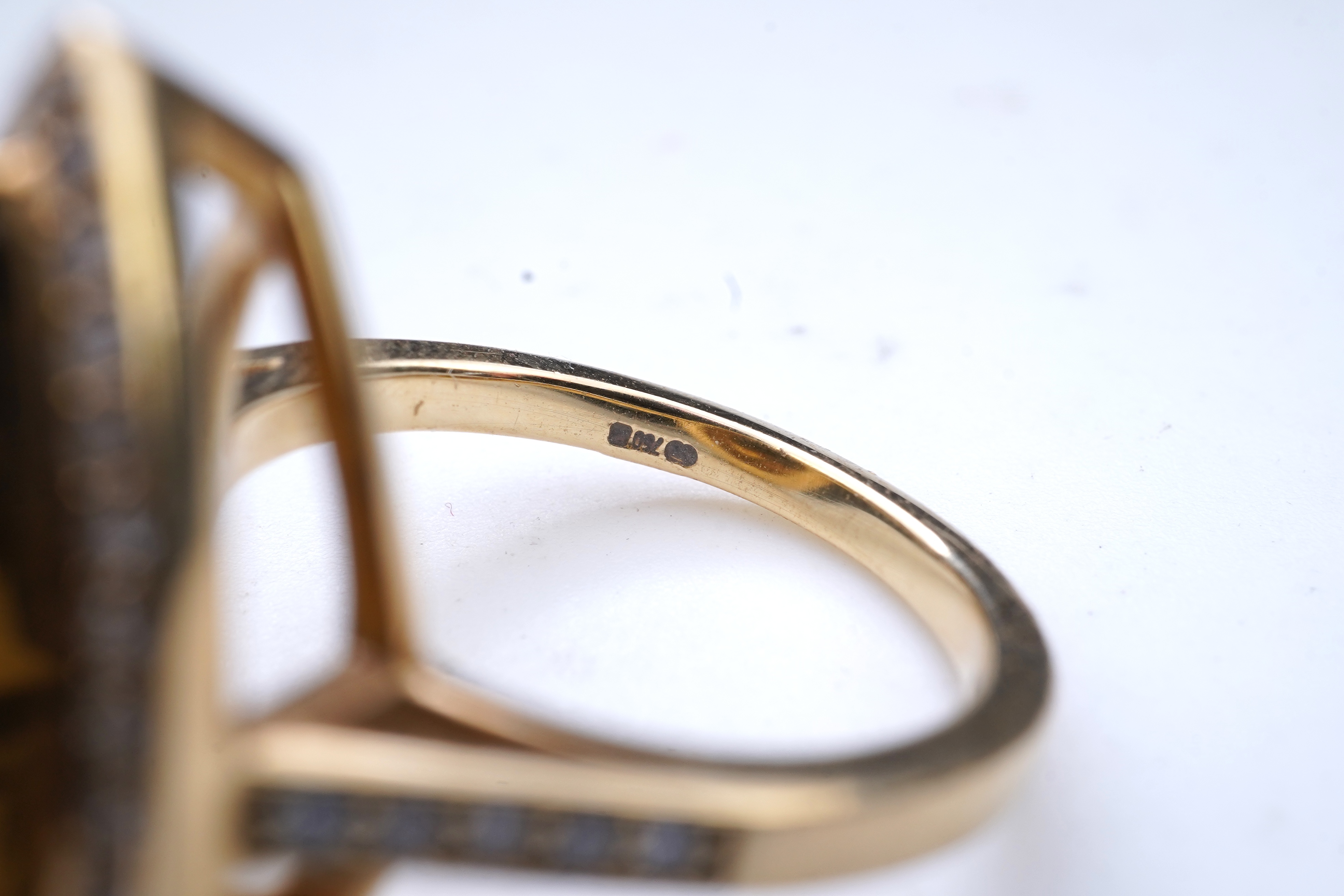 A smoky quartz and diamond ring